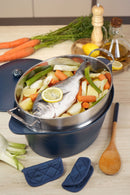 Delicious meal preparation in a cocotte with fish and vegetables, showcasing the L'Incroyable Cocotte de Cookut.