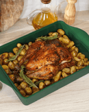 Plat ajustable Cookut en teinte Fougère, avec séparateur breveté pour ajuster facilement la taille du plat selon vos besoins culinaires.

