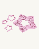 Set de 10 emporte-pièces Sapin de Noël 3D IBILI en plastique rose.
