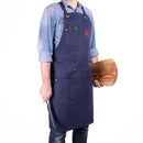 Tablier Alaskan Maker N°515 bleu marine en toile waxée déperlante.